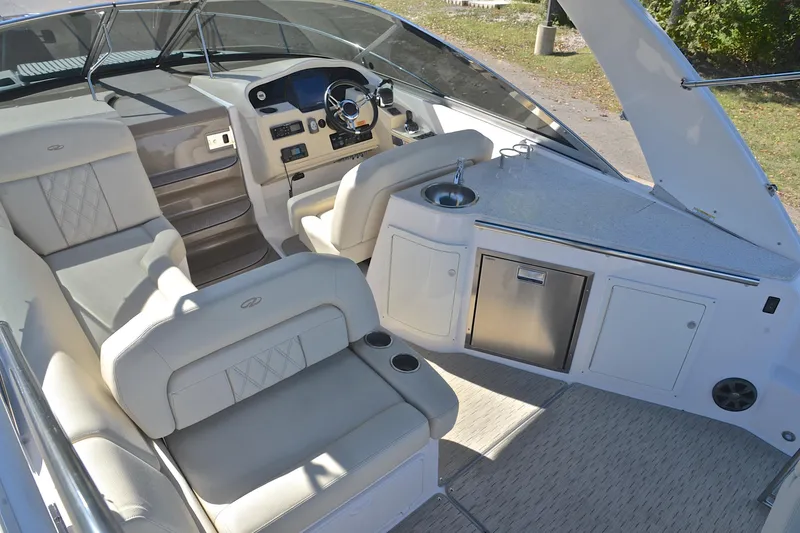 Slide: The Image of 2018 Regal 33 Express boat interior with luxurious seating and modern helm. - 23