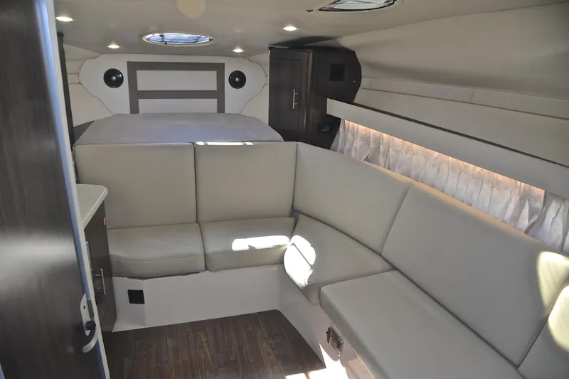 Slide: The Image of Interior of 2018 Regal 33 Express boat with beige seating and modern design. - 32