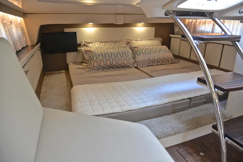 Slide: The Image of Luxurious interior cabin of 2018 Regal 33 Express yacht with cozy bedding and modern decor. - 38