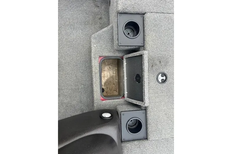 Slide: The Image of 2024 Tracker Pro Team 175 TXW boat interior with storage compartments and cup holders. - 12