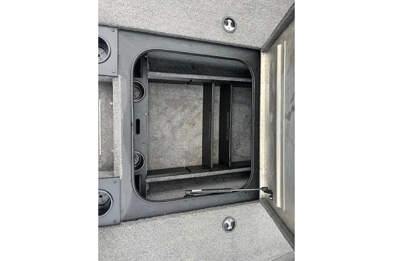 Slide: The Image of 2024 Tracker Pro Team 175 TXW boat storage compartment, open and empty. - 13