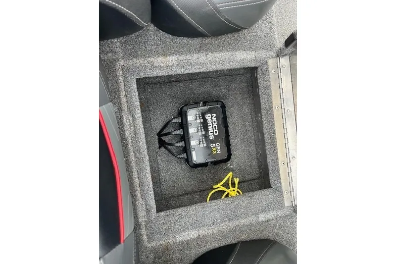 Slide: The Image of 2024 Tracker Pro Team 175 TXW boat storage with NOCO Genius GEN5X3 charger. - 19