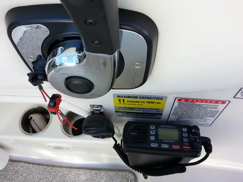 Slide: The Image of Control panel of a 2006 Monterey 233 Explorer boat with capacity and safety labels. - 21