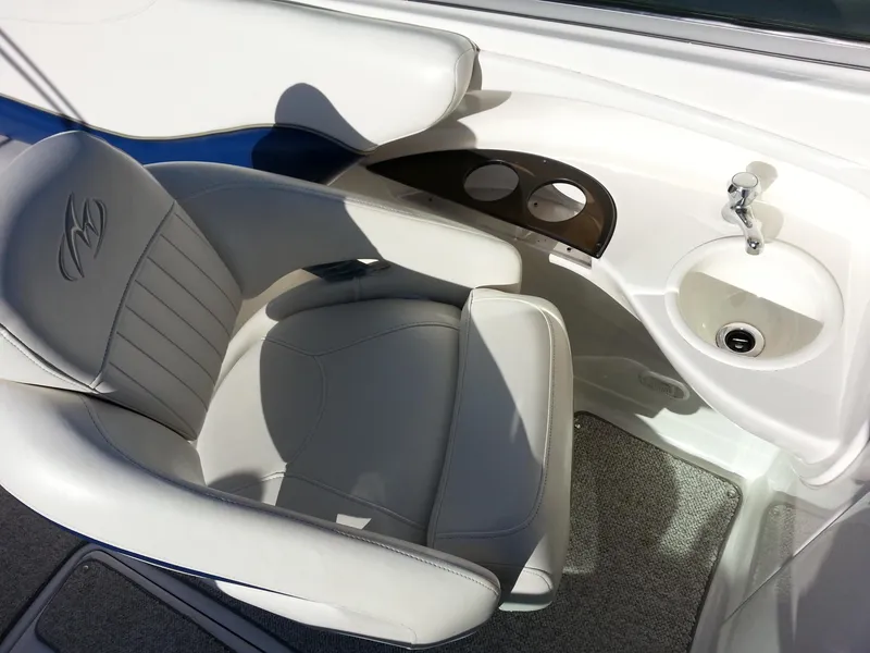 Slide: The Image of Captain's seat and console on a 2006 Monterey 233 Explorer boat. - 24