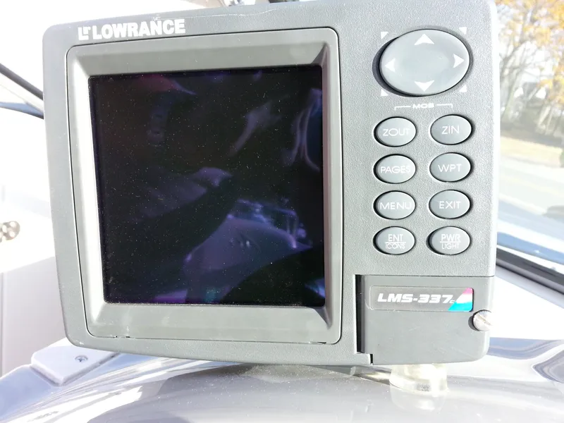 Slide: The Image of Lowrance LMS-337 fishfinder on 2006 Monterey 233 Explorer boat dashboard. - 29