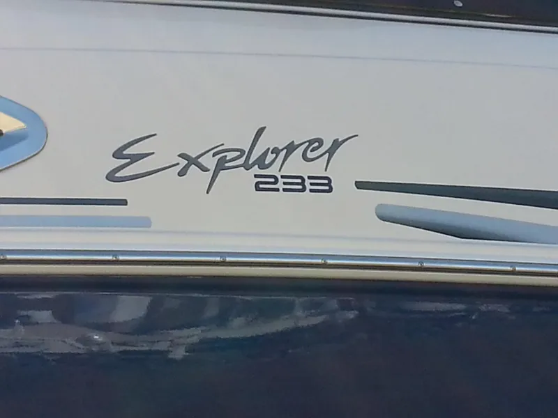 Slide: The Image of 2006 Monterey 233 Explorer boat logo on white surface. - 8