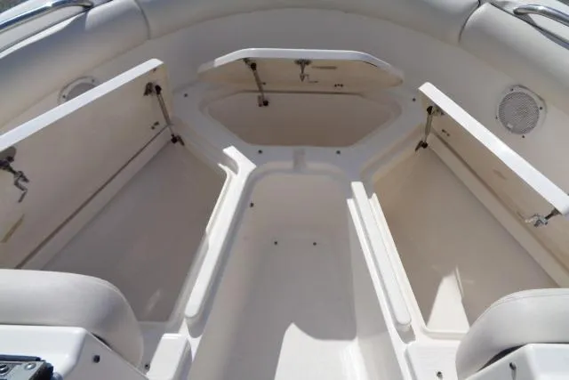 Slide: The Image of 2005 Robalo R227 Dual Console boat interior with open storage compartments. - 12