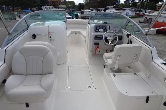 Slide: The Image of 2005 Robalo R227 Dual Console boat interior with steering wheel and seating. - 19