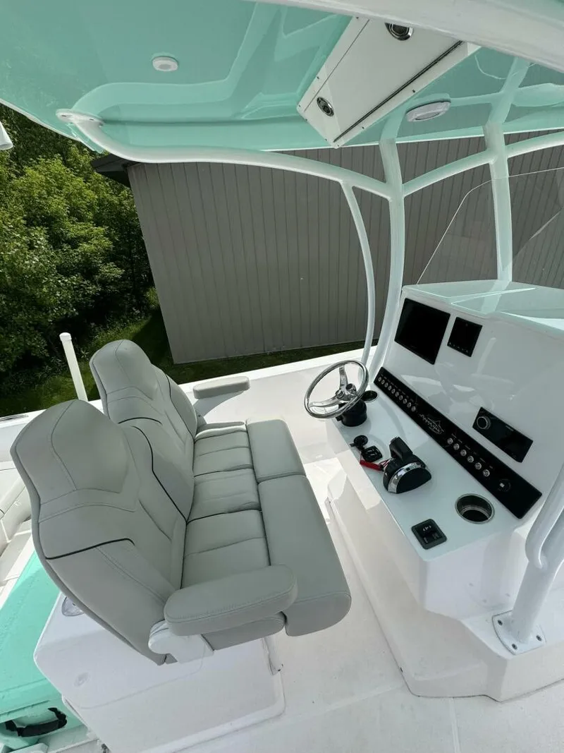 Slide: The Image of 2022 Streamline Center Console boat interior with dual seats and modern dashboard. - 14