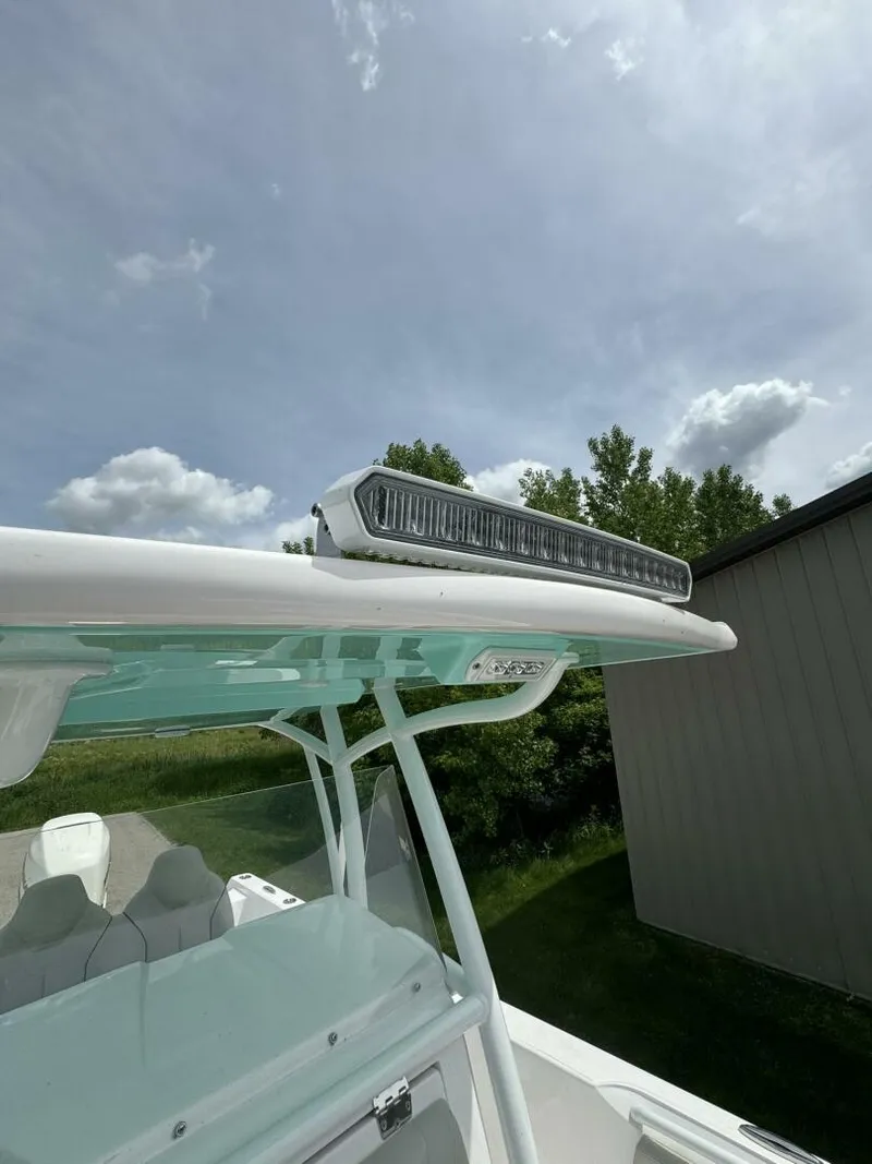 Slide: The Image of 2022 Streamline Center Console boat with mounted LED light bar under a cloudy sky. - 18