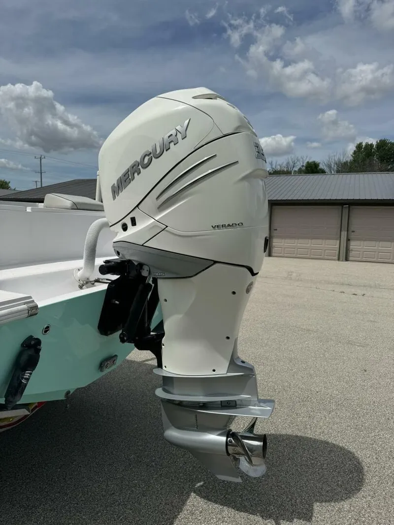 Slide: The Image of 2022 Streamline Center Console with Mercury Verado outboard motor, parked outdoors. - 4