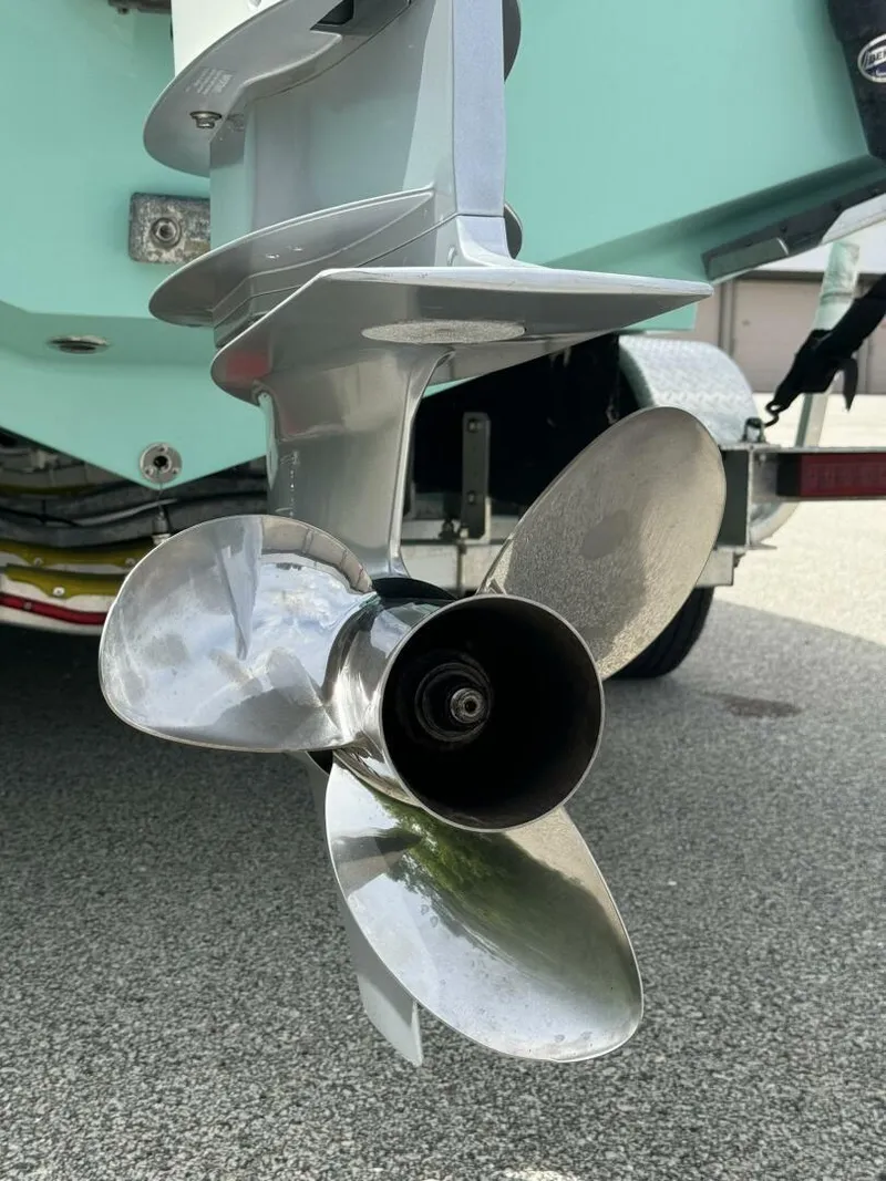 Slide: The Image of 2022 Streamline Center Console boat propeller, close-up view, shiny metal finish. - 7
