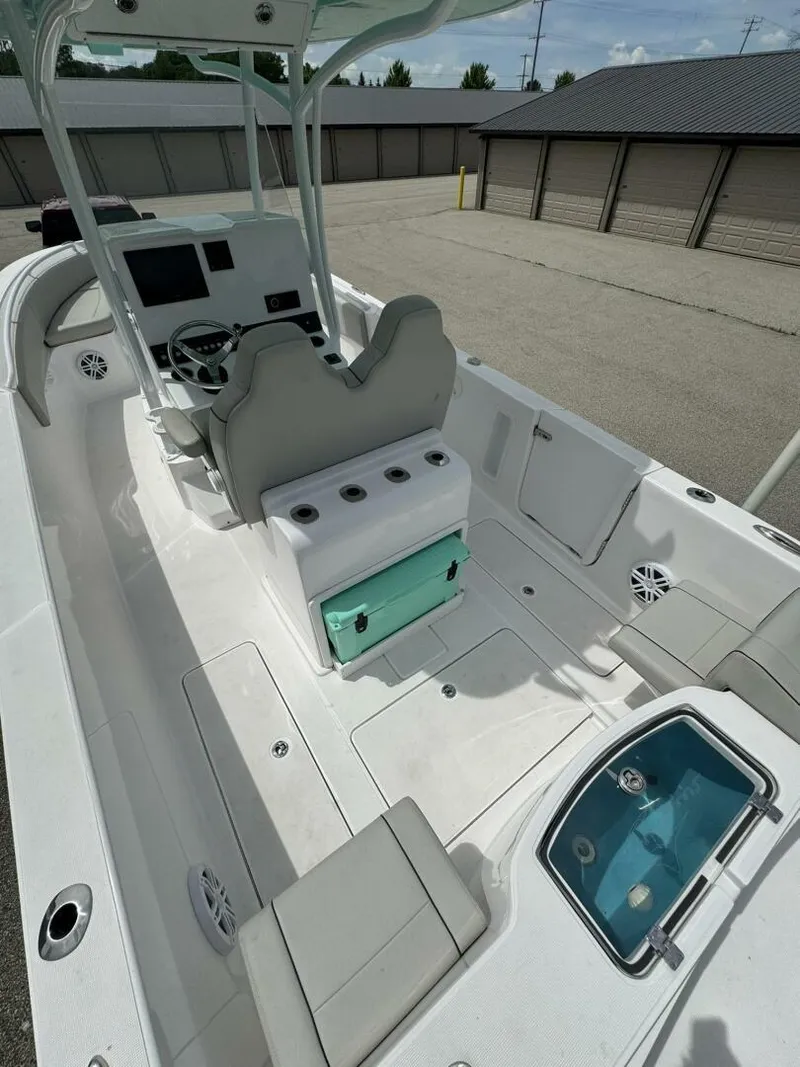 Slide: The Image of 2022 Streamline Center Console boat with seating, storage, and modern controls. - 9