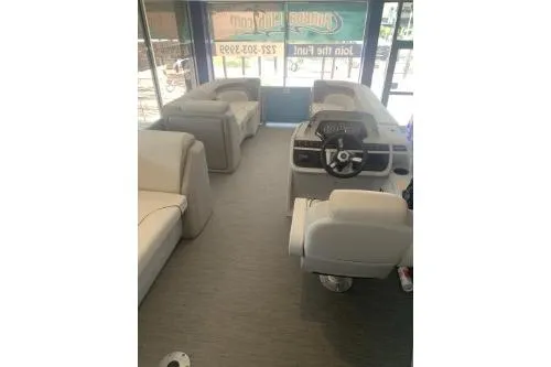 Slide: The Image of 2026 Godfrey Sweetwater 2086 CSE pontoon boat interior with plush seating and modern helm. - 10