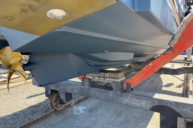 Slide: The Image of 2016 Ranger Tugs R-27 boat hull and propeller on a trailer. - 19