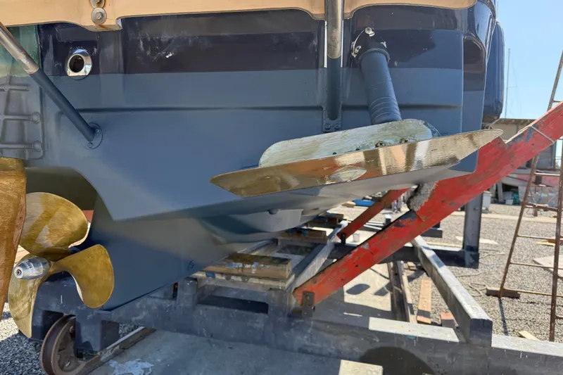 Slide: The Image of 2016 Ranger Tugs R-27 boat propeller and rudder on a trailer. - 4