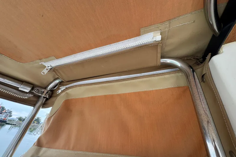 Slide: The Image of Interior view of 2016 Ranger Tugs R-27 boat canopy with metal frame and zippers. - 40