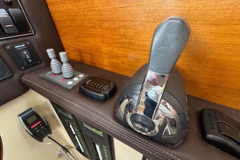 Slide: The Image of Control panel of a 2016 Ranger Tugs R-27 boat with throttle and switches. - 41