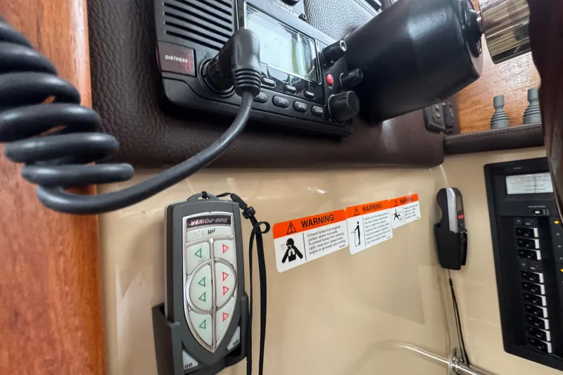 Slide: The Image of Control panel of a 2016 Ranger Tugs R-27 boat with warning labels. - 44