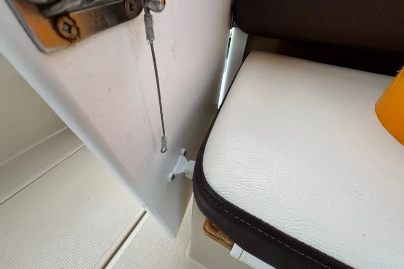 Slide: The Image of 2016 Ranger Tugs R-27 interior detail with seat and latch mechanism. - 53