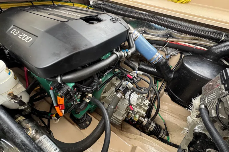 Slide: The Image of 2016 Ranger Tugs R-27 engine compartment with D3-200 engine components and wiring. - 56