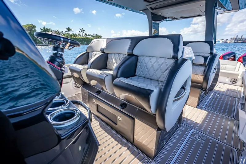 Slide: The Image of Luxurious interior of 2023 Nor-Tech 500 Sport boat with plush seating and modern design. - 12