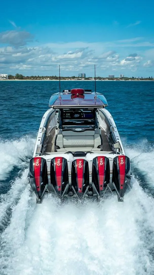 Slide: The Image of 2023 Nor-Tech 500 Sport boat with multiple engines cruising on open water. - 27