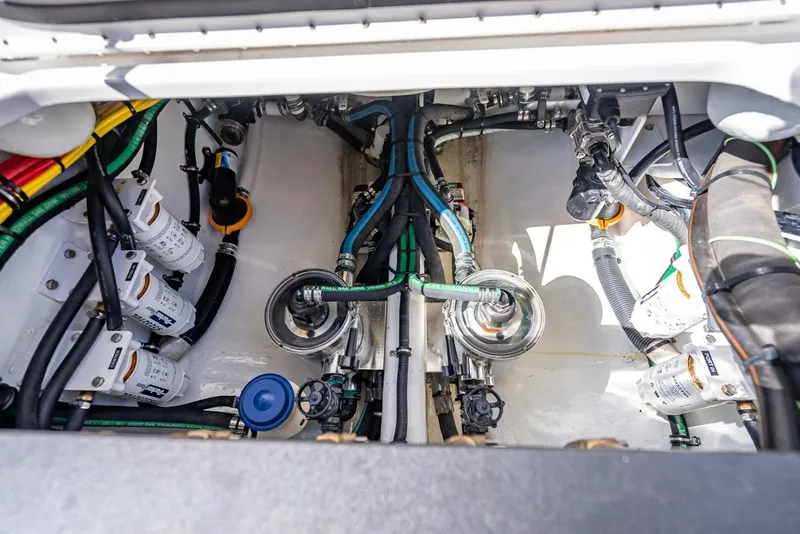 Slide: The Image of Engine compartment of 2023 Nor-Tech 500 Sport boat, showcasing intricate wiring and components. - 41