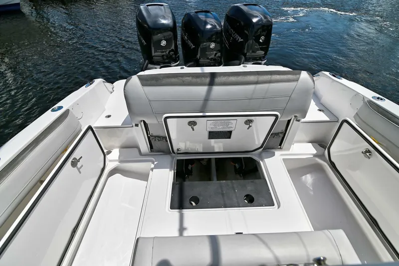 Slide: The Image of 2020 Nor-Tech 340 Sport boat with triple engines and spacious deck layout. - 14