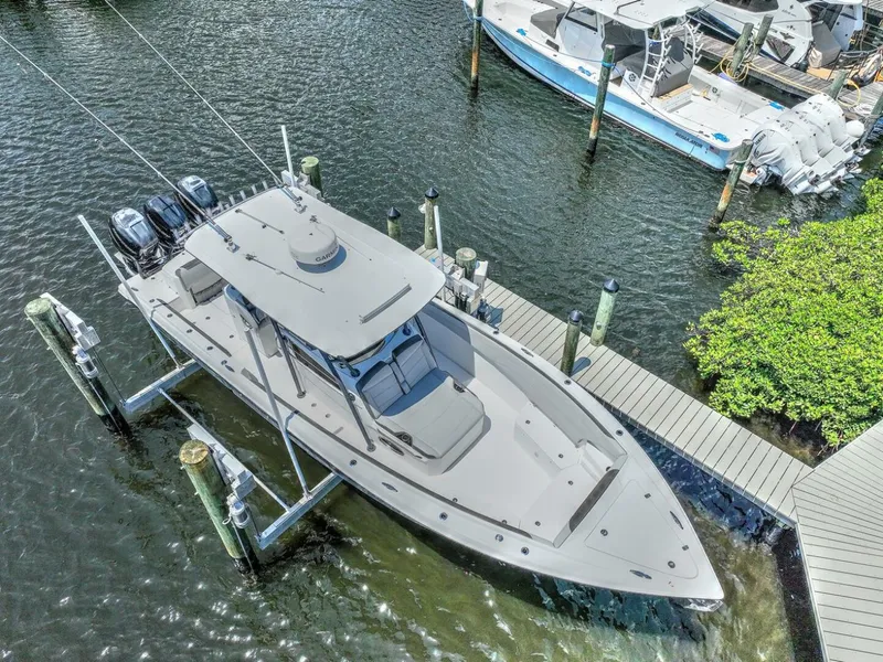 Slide: The Image of 2020 Nor-Tech 340 Sport boat docked in marina, aerial view. - 36