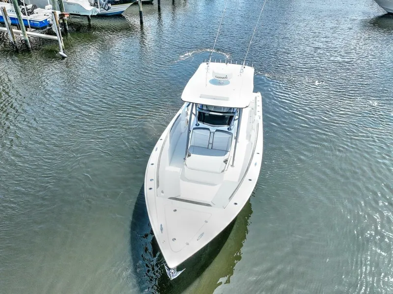 Slide: The Image of 2020 Nor-Tech 340 Sport boat on calm water, aerial view. - 4