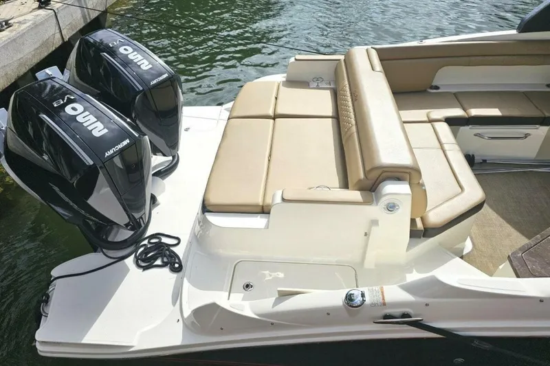 Slide: The Image of 2018 Sea Ray SDX 290 Outboard boat with dual Mercury engines and tan seating. - 11