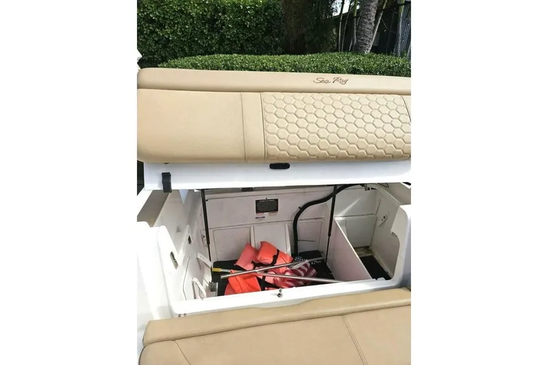 Slide: The Image of 2018 Sea Ray SDX 290 Outboard storage compartment with life jackets and equipment. - 19