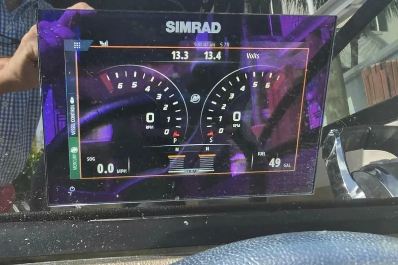 Slide: The Image of Simrad display on 2018 Sea Ray SDX 290 Outboard showing RPM, speed, and fuel levels. - 26