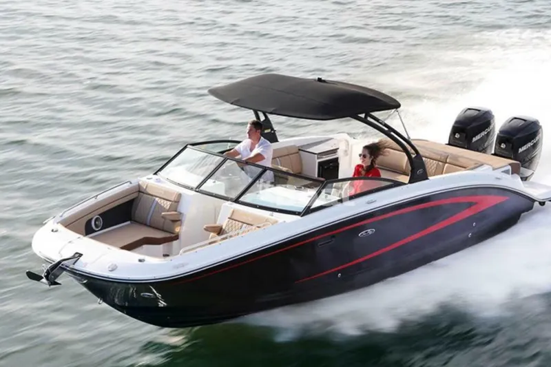 Slide: The Image of 2018 Sea Ray SDX 290 Outboard cruising on open water, featuring sleek design and powerful engines. - 4