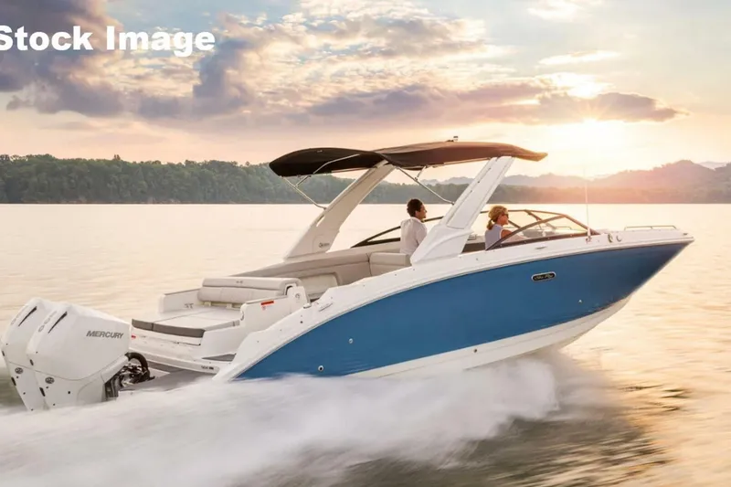 Slide: The Image of 2018 Sea Ray SDX 290 Outboard cruising on a lake at sunset. - 6