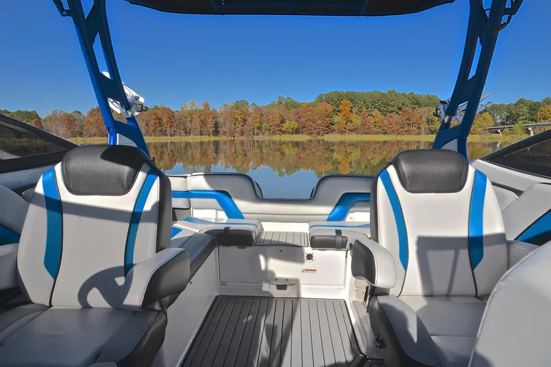 Slide: The Image of 2018 Yamaha Boats 242X interior with lake view and autumn foliage. - 22