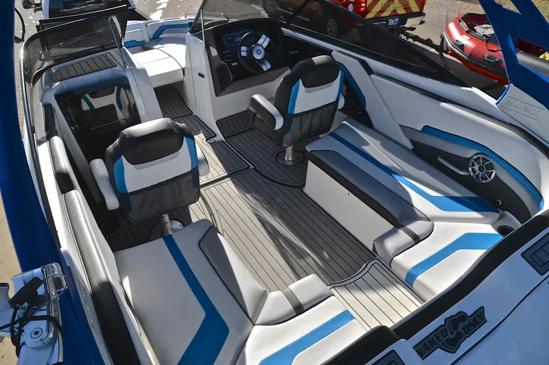 Slide: The Image of 2018 Yamaha Boats 242X interior with modern seating and sleek design. - 24