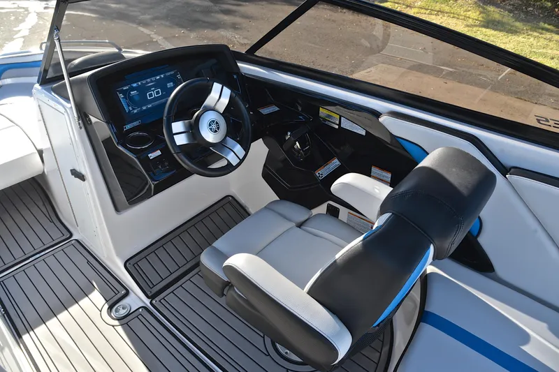 Slide: The Image of 2018 Yamaha Boats 242X cockpit with modern steering and dashboard controls. - 25