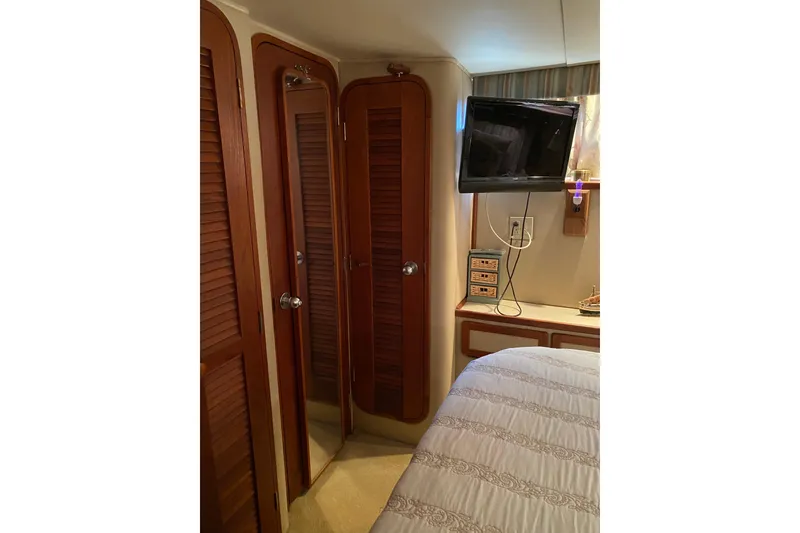Slide: The Image of Interior of 1986 Chris-Craft 426 Catalina with wood paneling and mounted TV. - 20