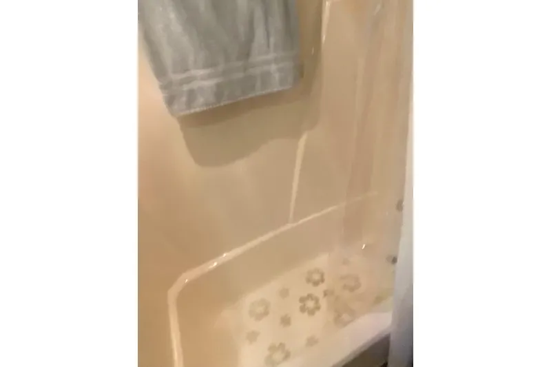 Slide: The Image of Shower area in 1986 Chris-Craft 426 Catalina boat with floral-patterned mat. - 22