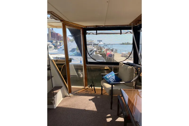 Slide: The Image of Interior view of 1986 Chris-Craft 426 Catalina yacht with marina backdrop. - 31