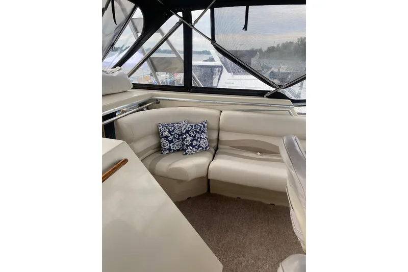 Slide: The Image of Interior of 1986 Chris-Craft 426 Catalina yacht with beige seating and decorative pillow. - 38
