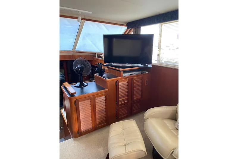 Slide: The Image of Interior of 1986 Chris-Craft 426 Catalina with TV, fan, and leather seating. - 4
