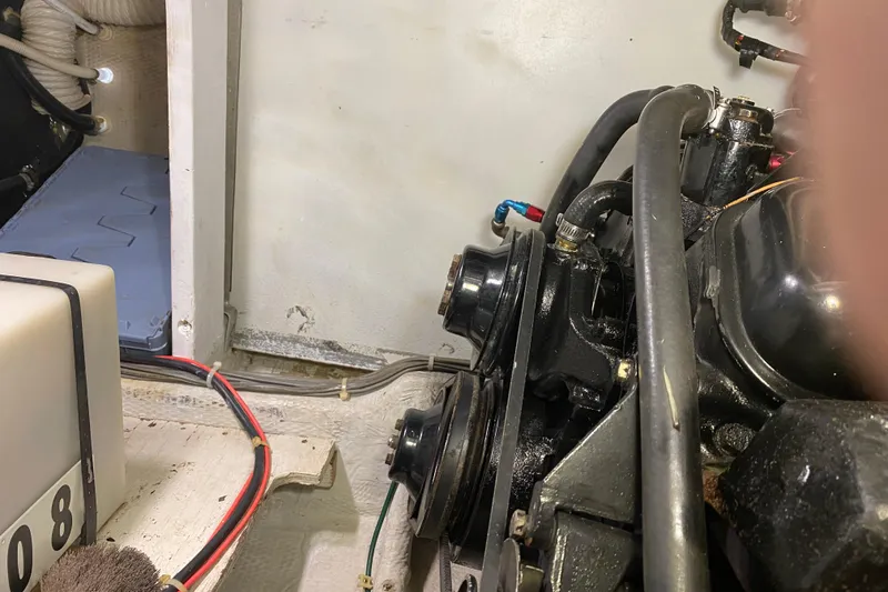 Slide: The Image of Engine compartment of a 1986 Chris-Craft 426 Catalina boat, showing mechanical components. - 44