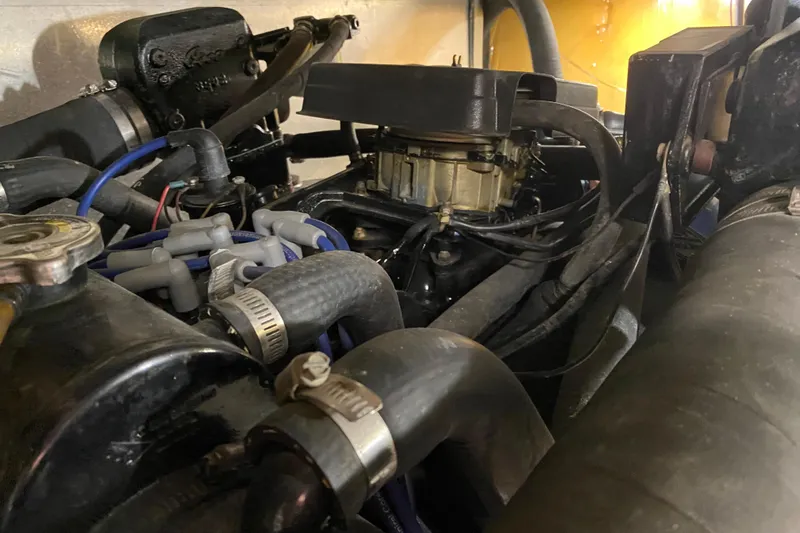 Slide: The Image of Engine compartment of a 1986 Chris-Craft 426 Catalina boat, showcasing mechanical components. - 45