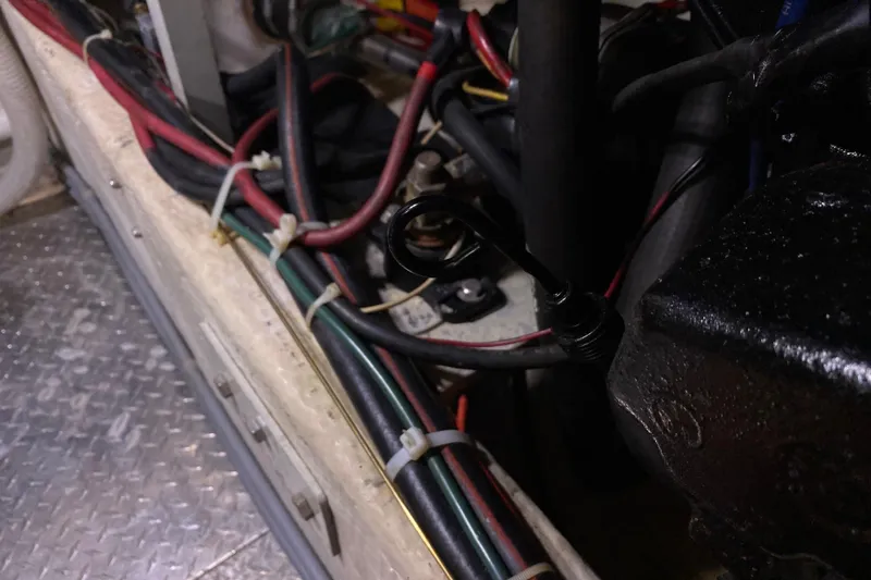 Slide: The Image of Engine compartment of 1986 Chris-Craft 426 Catalina with visible wiring and components. - 46