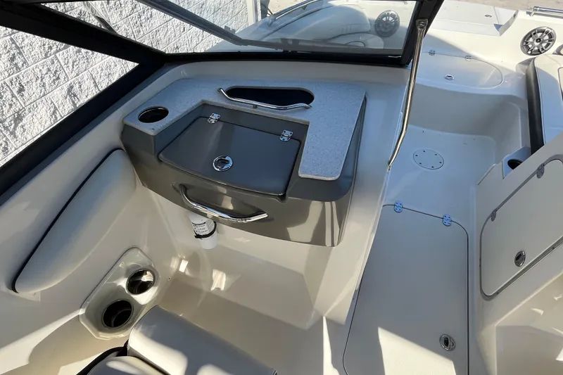 Slide: The Image of 2020 Stingray 201DS boat interior with seating and storage compartments. - 15