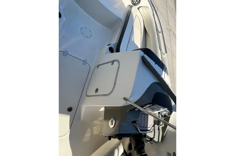 Slide: The Image of 2020 Stingray 201DS boat interior with seating and storage compartments. - 18