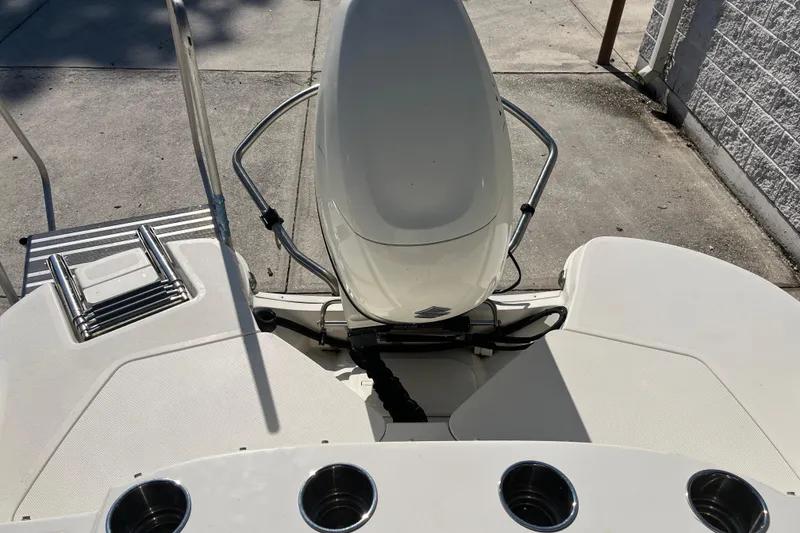 Slide: The Image of 2020 Stingray 201DS boat deck with seating and cup holders. - 29